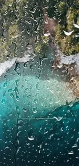 Wallpaper of tranquil lake view with raindrops on glass effect and lush green trees.