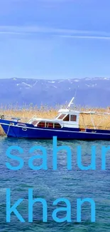 A serene image of a lake with a blue boat and golden reeds under a clear sky.