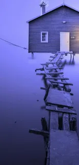 Tranquil lake house with a wooden pier at dusk, in blue tones.