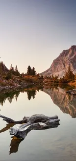 Lake reflecting mountains under a serene sky.