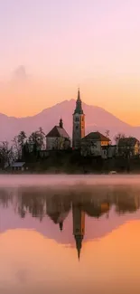 Serene sunset lake reflection with landscape and misty ambiance.