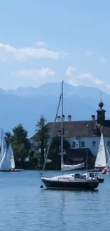 Sailboats on a serene lake under a clear blue sky.