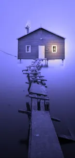 Tranquil lakeside cabin on misty blue evening.