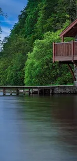 Serene lakeside cabin with lush greenery and calm waters.