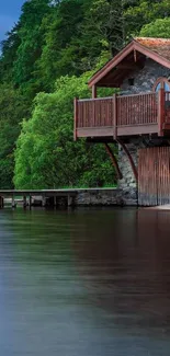 Lakeside cabin with lush greenery and calm lake view under a blue sky.