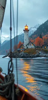 Lighthouse on a lake with autumn trees and mountains.