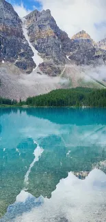 Serene mountain lake with reflections and forests under blue skies.