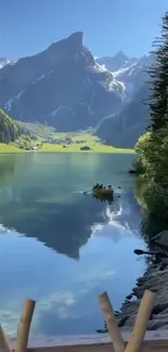 Serene mountain lake with lush greenery and towering peaks under a clear blue sky.