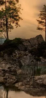 Serene mountain lake with trees at dusk, creating a tranquil wallpaper.