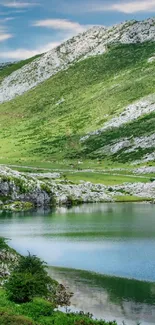 Serene mountain lake with green hills.