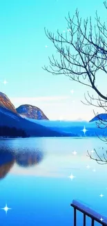 Serene mountain lake reflecting blue sky with snowy mountains.