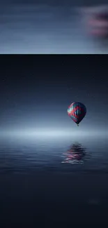 Hot air balloon over moonlit ocean at night with starry sky backdrop.