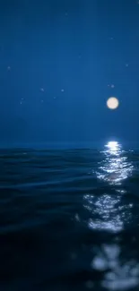 Starry night over ocean with moon reflecting on water.