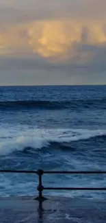 Calm ocean waves under a glowing sunset sky, providing a serene view.