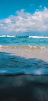 Peaceful beach with blue ocean and sky.