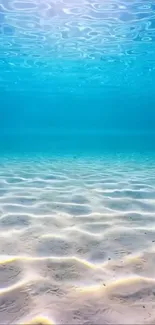 Serene ocean floor with clear blue water and sandy ripples, perfect mobile wallpaper.