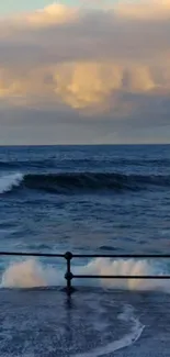 Calm ocean waves against a cloudy sky horizon at dusk.