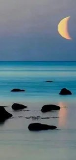 Ocean view with crescent moonrise, tranquil evening scene.