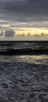 A tranquil ocean sunset with calm waves and a golden sky.