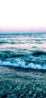 Tranquil ocean at sunset with pastel sky hues.