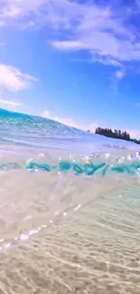 A calming ocean wave under a bright blue sky, perfect for a mobile wallpaper.