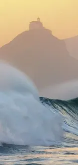 Ocean waves with sunset and mountains in the background.