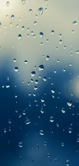 Raindrops on a window creating a serene mobile wallpaper.