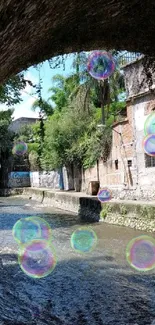 Tranquil river scene under a stone archway with lush greenery.