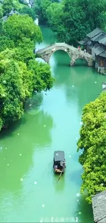 Serene riverside village with bridge and boat amidst lush greenery.