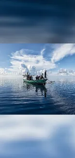 Serene wallpaper of a boat on a tranquil, expansive blue sea with clouds overhead.