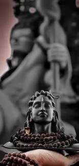 Tranquil Shiva statue on mobile wallpaper.