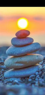 Cairn of stones with sunset background.