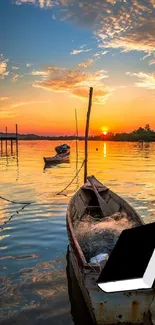 Small boat on a calm lake at dawn with vibrant orange and blue sky.