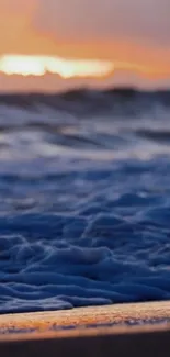 Tranquil ocean waves during sunset at a serene beach.