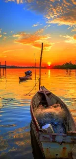 Boats resting on a calm lake during a vibrant sunset.