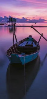 Lonely boat on calm water during a stunning purple sunset.