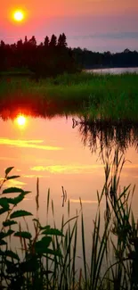 Serene lake with sunset reflecting vibrant colors.