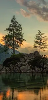 Serene sunset lake view with trees and rocks.