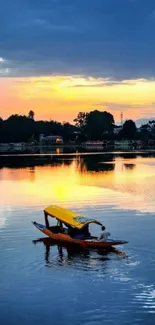 A serene sunset over a lake with an orange boat in the foreground.