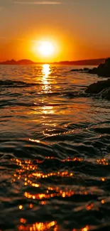 Vibrant sunset over a calm ocean with reflections.