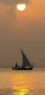 Tranquil sailboat on golden sunset sea.