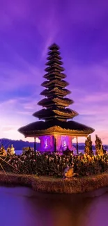 Purple sunset over tranquil temple landscape.