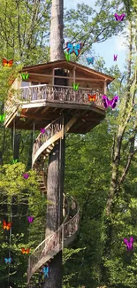 Treehouse with spiral stairs in a lush green forest, perfect for nature lovers.