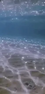 Tranquil underwater ocean scene with sparkling lights on the sea floor.