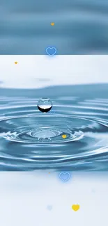 A single droplet creates ripples on a calm blue water surface with small heart shapes.