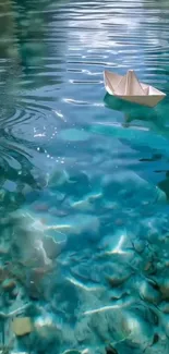Paper boat floating on clear blue water.