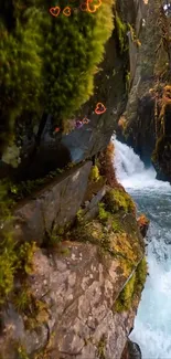 Lush forest waterfall scene with moss-covered rocks and flowing water.