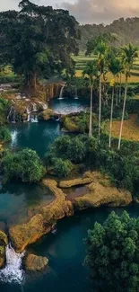 A tranquil waterfall surrounded by lush green forest and clear water.