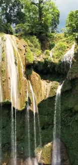 Cascading waterfalls in lush green forest, creating a tranquil natural scene.