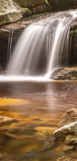 Mobile wallpaper featuring a serene waterfall and rocks.